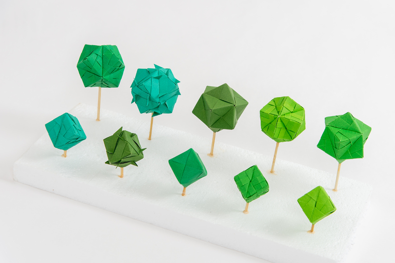 Various color green origami orbs. Second view.
