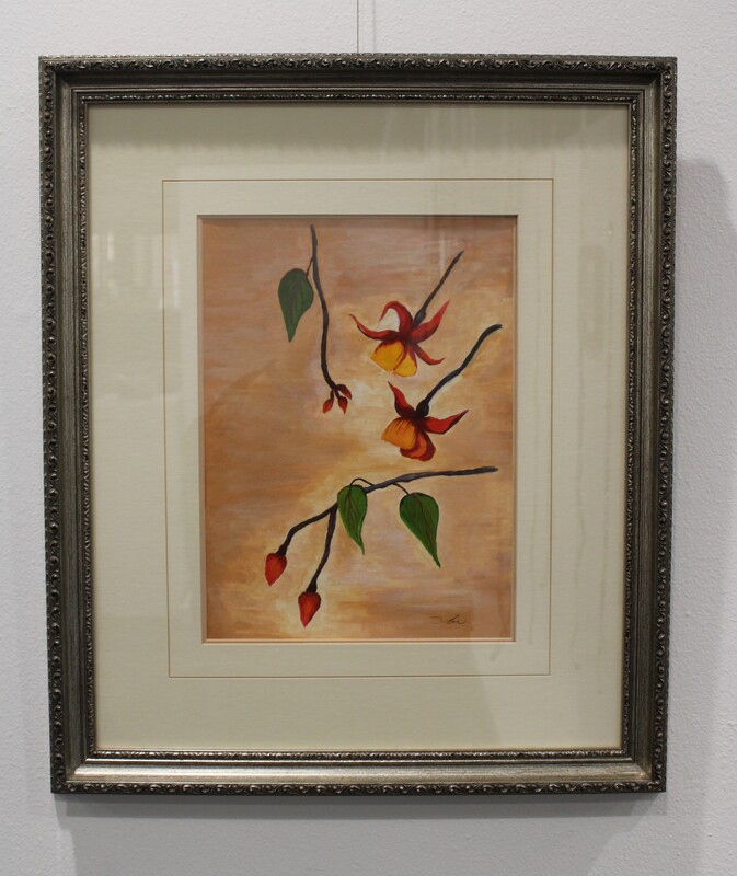 Framed painting of branches with red flowers and green leaves on an orange background.