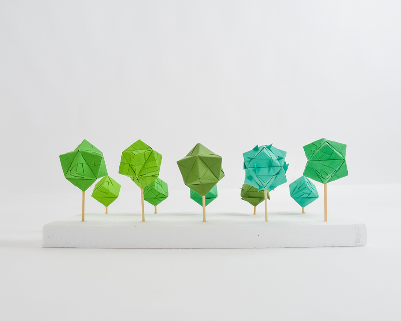 Various color green origami orbs. Third view.