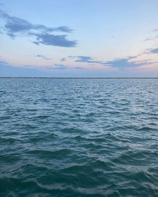 color photograph of a skyline over a body of water