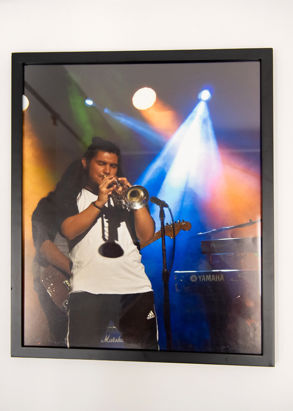 A man playing a trumpet on stage. 