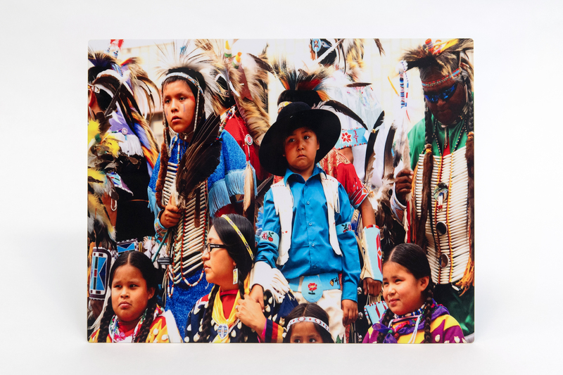 Image of an audience of people at a rodeo.