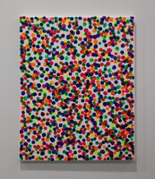 An artwork with multicolored dots on a white canvas.
