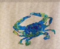 Artist: Jennifer Anderson. 54 by 42-inch raw edged appliqué quilt titled #RockportStrong. Blue and green fabric scraps are appliquéd to a sandy colored background fabric. The scraps are arranged in the shape of a blue crab. The piece is quilted with rippling lines horizontally across the piece.