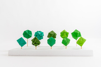 Various color green origami orbs. 