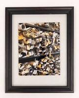 Image of architectural drawings rolled up on a shelf.