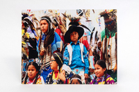 Image of an audience of people at a rodeo.