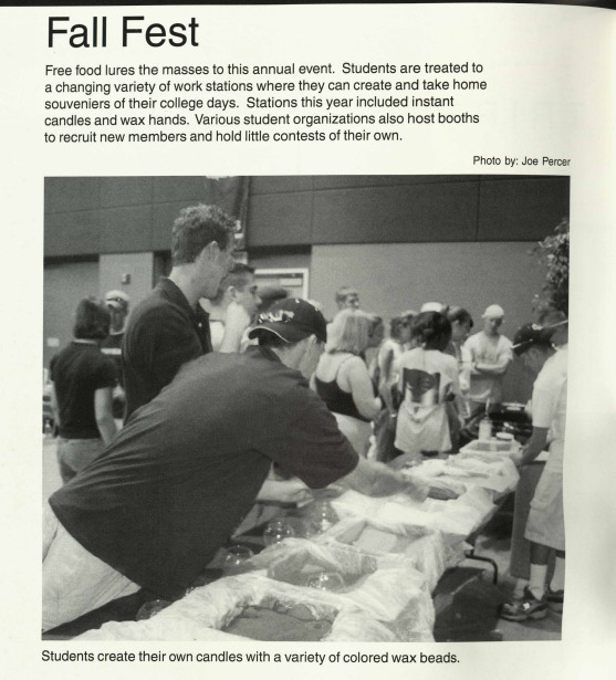 Students serving themselves food from a table. 