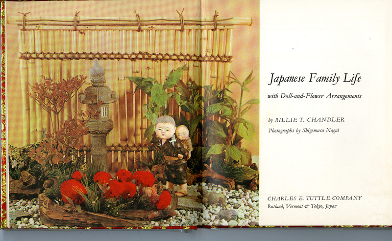 Open book with a Japanese floral and doll arrangement on the left, text on the right.
Text Transcription:
Japanese Family Life
with Doll-and-Flower Arrangements
by BILLIE T. CHANDLER
Photographs by Shigemasa Nagai
CHARLES E. TUTTLE COMPANY
Rutland, Vermont & Tokyo, Japan