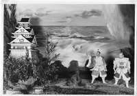 Diorama of a Japanese castle by the sea with two figures in traditional attire.