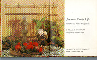 Open book with a Japanese floral and doll arrangement on the left, text on the right.

Text Transcription:

Japanese Family Life
with Doll-and-Flower Arrangements

by BILLIE T. CHANDLER
Photographs by Shigemasa Nagai

CHARLES E. TUTTLE COMPANY
Rutland, Vermont & Tokyo, Japan