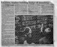 Black-and-white newspaper clipping with article about Billie Chandler at the Japanese Art Museum and a photograph of her with students viewing a doll collection.

Transcription:

Title: Children, teacher building bridge of friendship
Caption: BILLIE TRIMBLE CHANDLER TELLS STUDENTS ABOUT DOLL COLLECTION IN MUSEUM