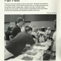 Students serving themselves food from a table. 