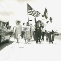 Photograph of Dr. Garcia and his sister Clotilde participating in a march to demand rights for farm workers.