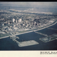 This is a photograph of the city of Corpus Christ, Texas in 1956 posted in TheSilverKing yearbook. This photo is of landscape of downtown. 