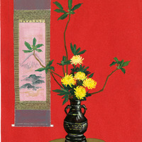  A dark vase with yellow chrysanthemum flowers and a scroll painting on a red background.