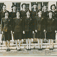 Women in uniforms in a group of two rows of five.