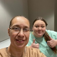 A selfie of two students in a qualitative dissertation class on TAMUCC campus fall 2023. 