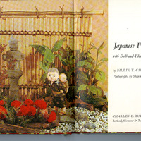 Open book with a Japanese floral and doll arrangement on the left, text on the right.

Text Transcription:

Japanese Family Life
with Doll-and-Flower Arrangements

by BILLIE T. CHANDLER
Photographs by Shigemasa Nagai

CHARLES E. TUTTLE COMPANY
Rutland, Vermont & Tokyo, Japan