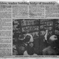 Black-and-white newspaper clipping with article about Billie Chandler at the Japanese Art Museum and a photograph of her with students viewing a doll collection.

Transcription:

Title: Children, teacher building bridge of friendship
Caption: BILLIE TRIMBLE CHANDLER TELLS STUDENTS ABOUT DOLL COLLECTION IN MUSEUM