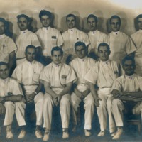 Photograph of St. Joseph's hospital interns with Dr. Garcia seated on the far right.