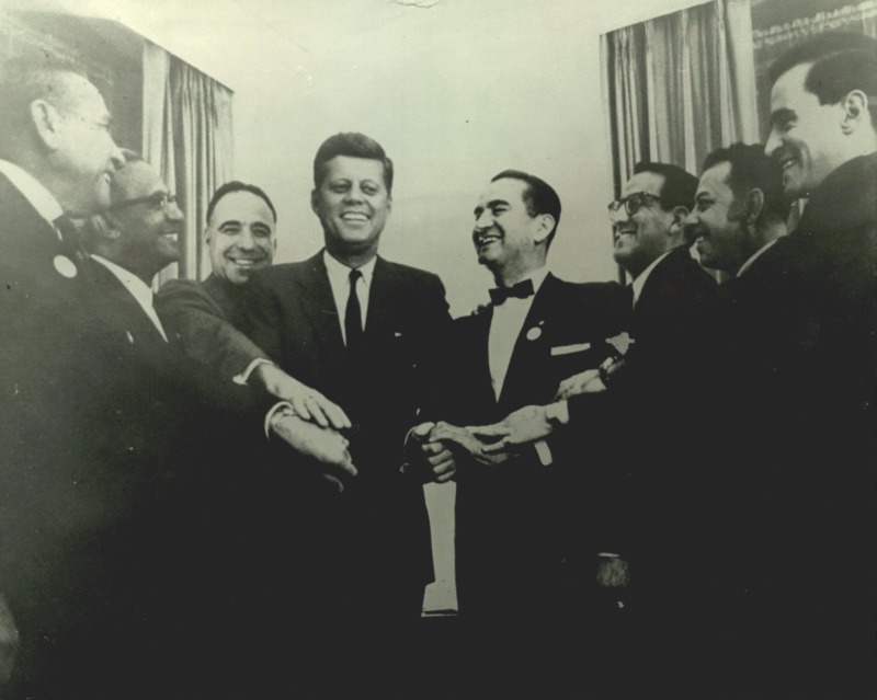 Photograph of John F. Kennedy with Viva Kennedy club leaders. 