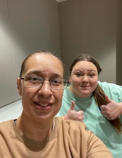 A selfie of two students in a qualitative dissertation class on TAMUCC campus fall 2023. 