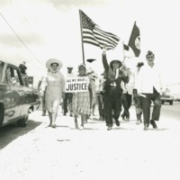 Photograph of Dr. Garcia and his sister Clotilde participating in a march to demand rights for farm workers. 